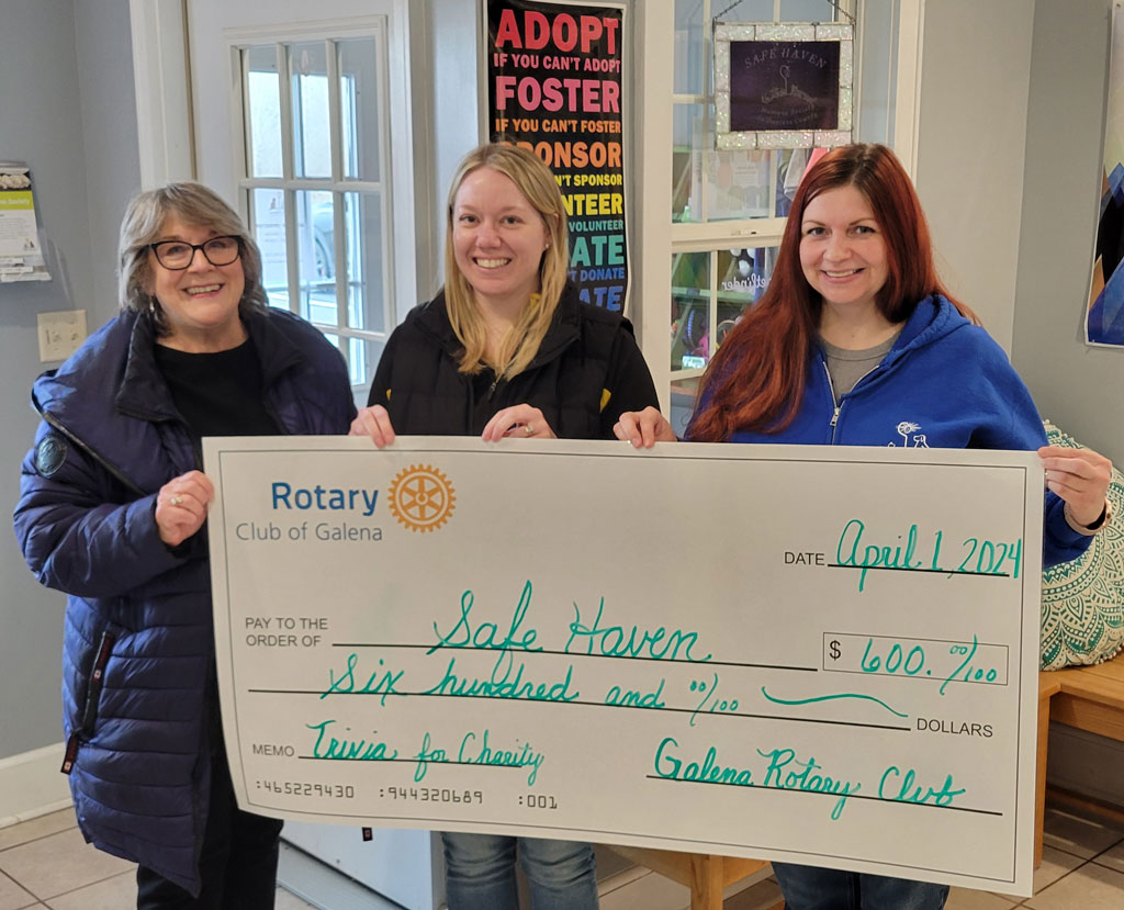 Check delivered to Safe Haven by Rotarians